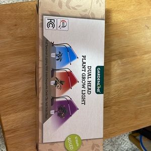 New in box dual head with plant grow light
